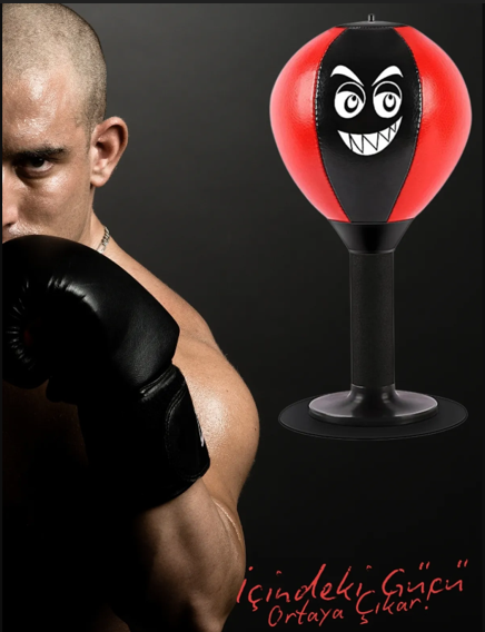 Person wearing boxing gloves with a punching bag featuring a face design.